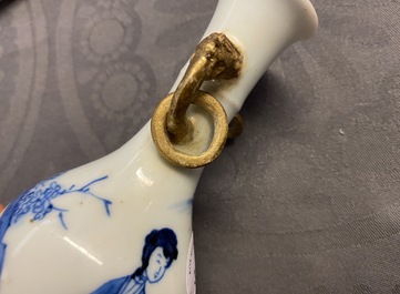 A Chinese blue and white vase with gilt elephant-head handles, Kangxi